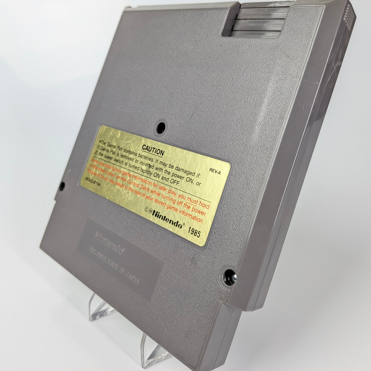 Gray cartridge with a label on a white background