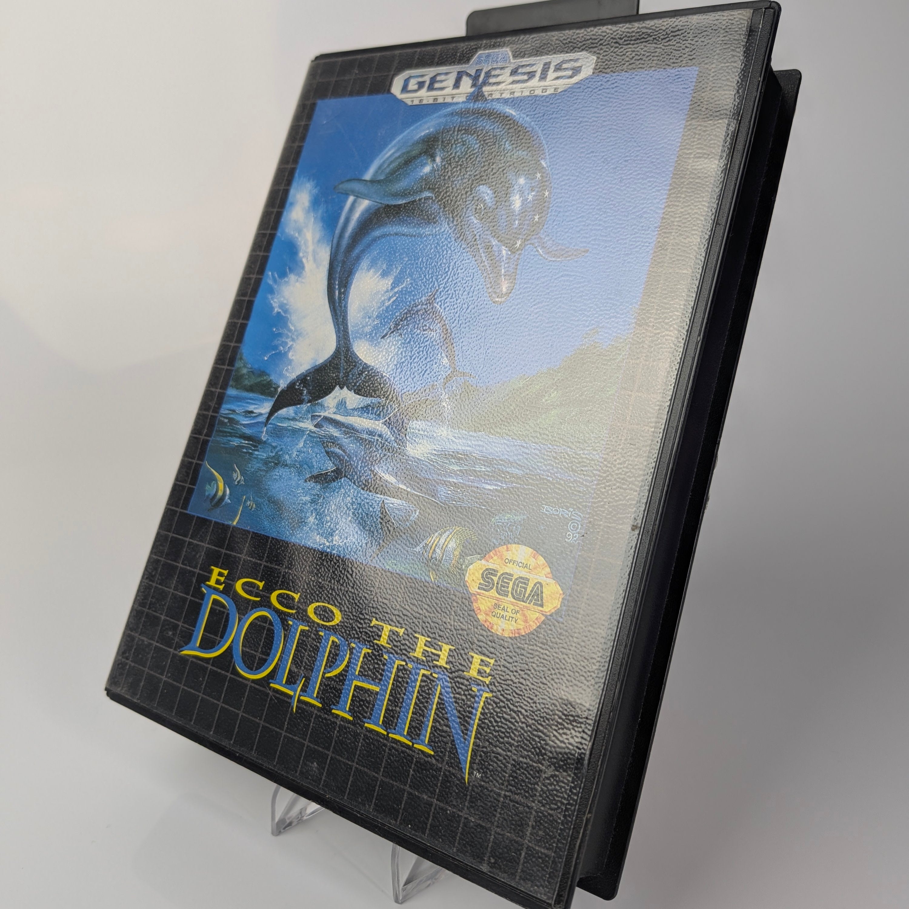 Ecco the Dolphin game cartridge for Sega Genesis on a gray background