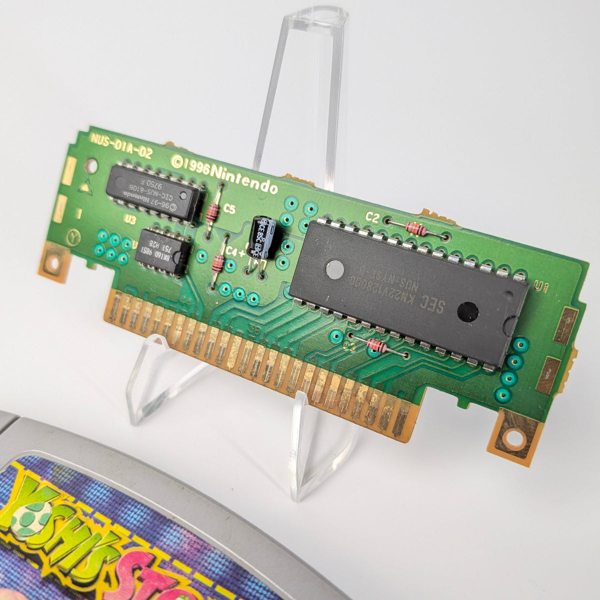 Nintendo Game Boy cartridge with a green circuit board on a white background