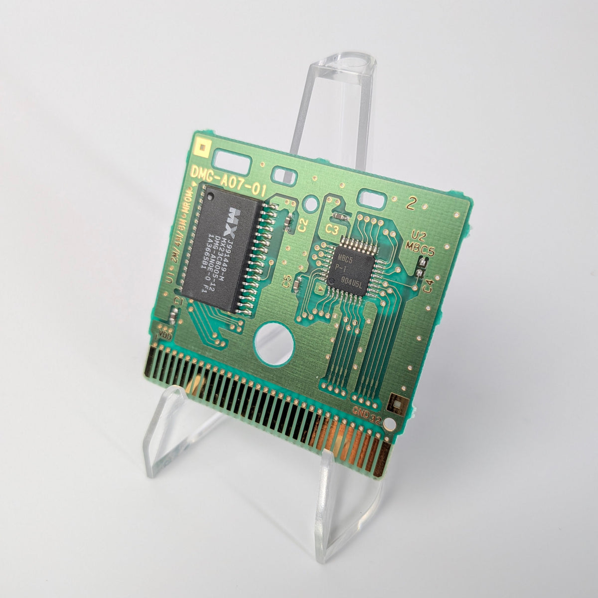 Computer memory card on a stand against a white background