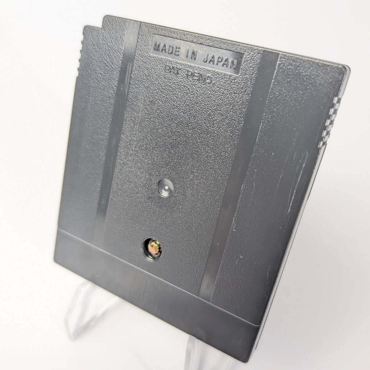 Metallic object with 'Made in Japan' label on a white background