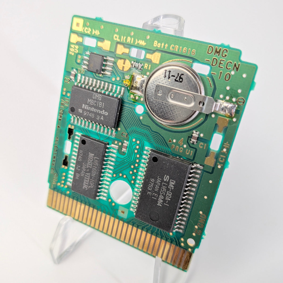 Electronic circuit board on a stand with a white background