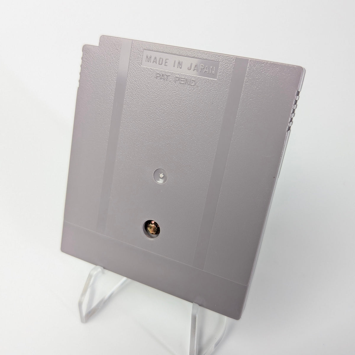 Gray electronic component on a white background