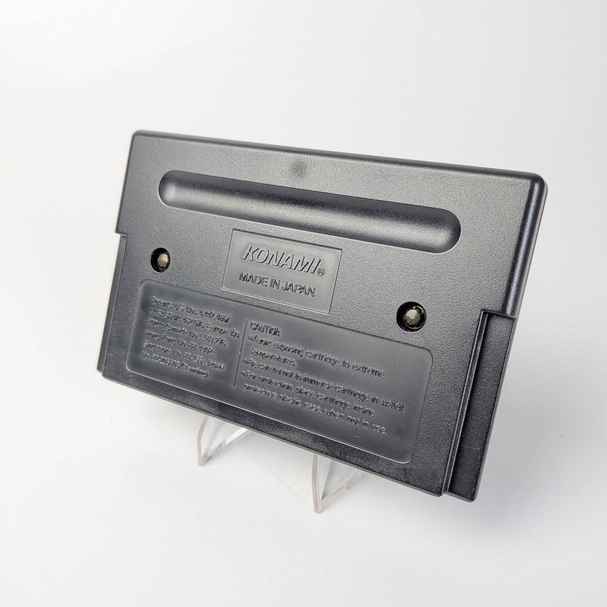 Gray cartridge with 'Konami' branding on a white background