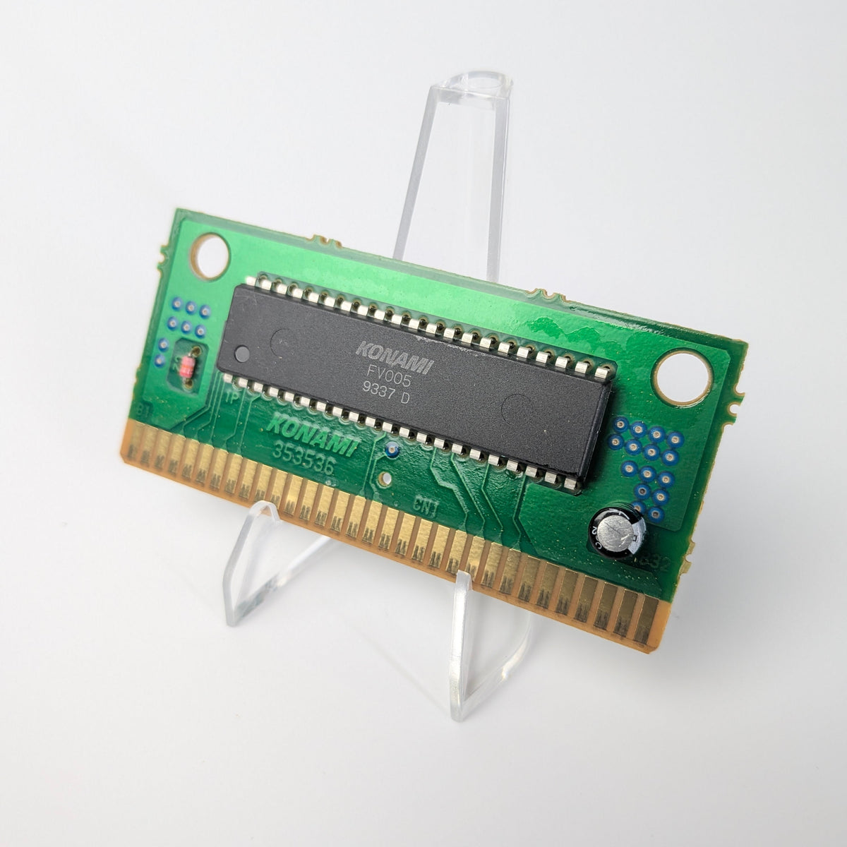 Computer memory module on a stand against a white background