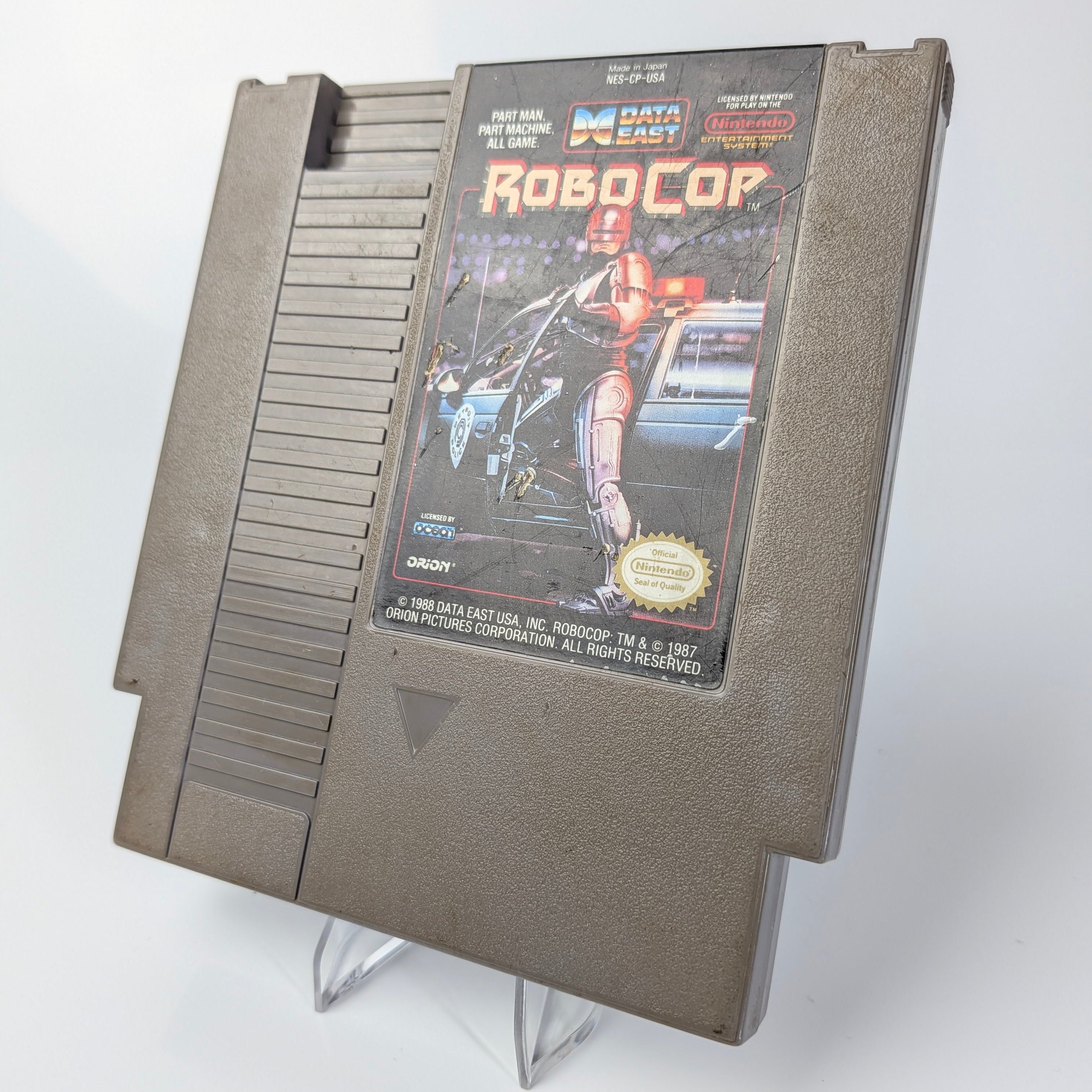 Nintendo Entertainment System (NES) game cartridge for 'RoboCop' on a white background