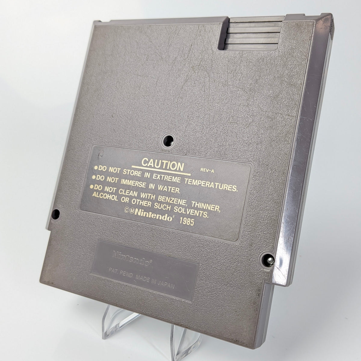 Gray cartridge with 'Nintendo' branding on a white background