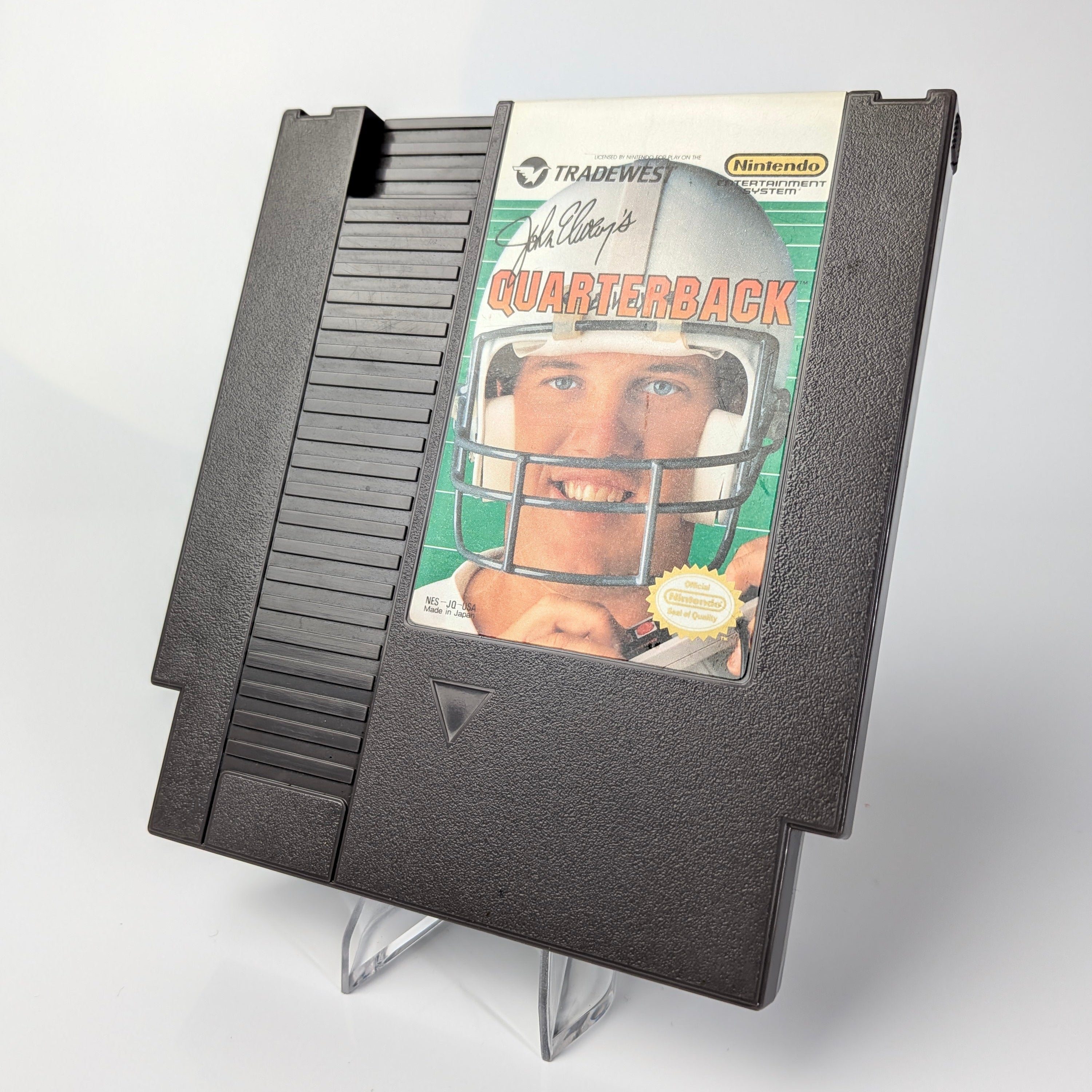 Nintendo NES game cartridge with a football player on the cover
