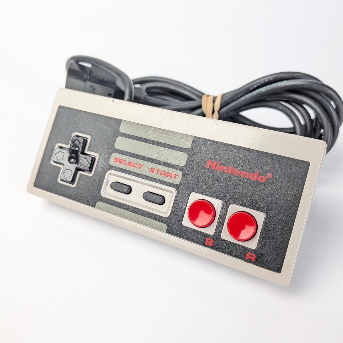 Nintendo NES controller on a white background