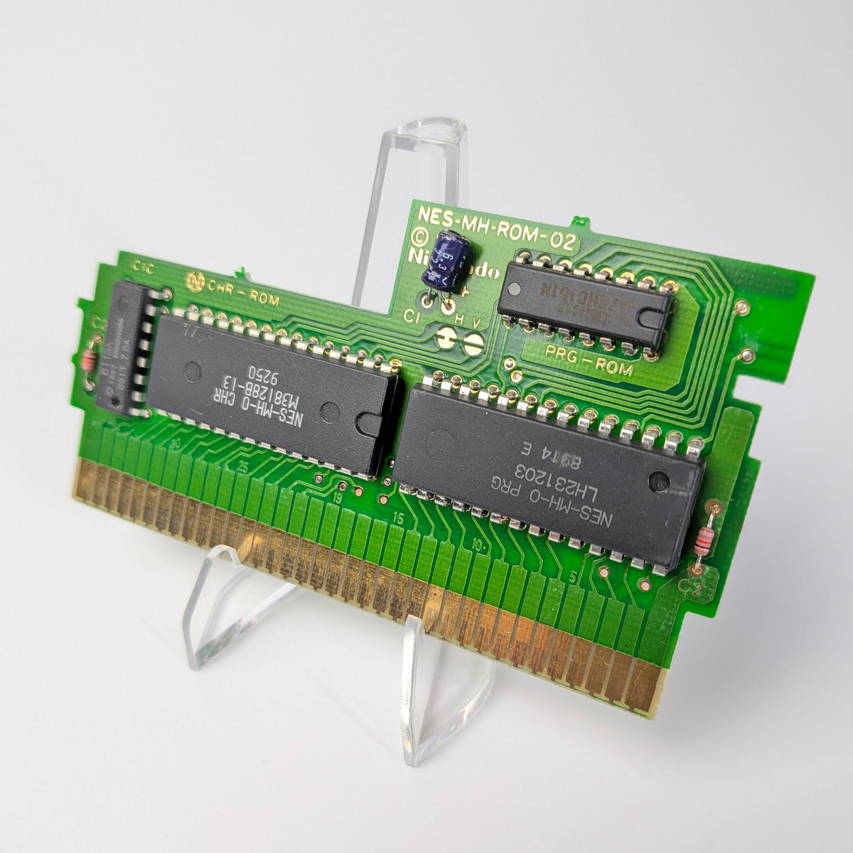 Computer memory module on a stand against a white background