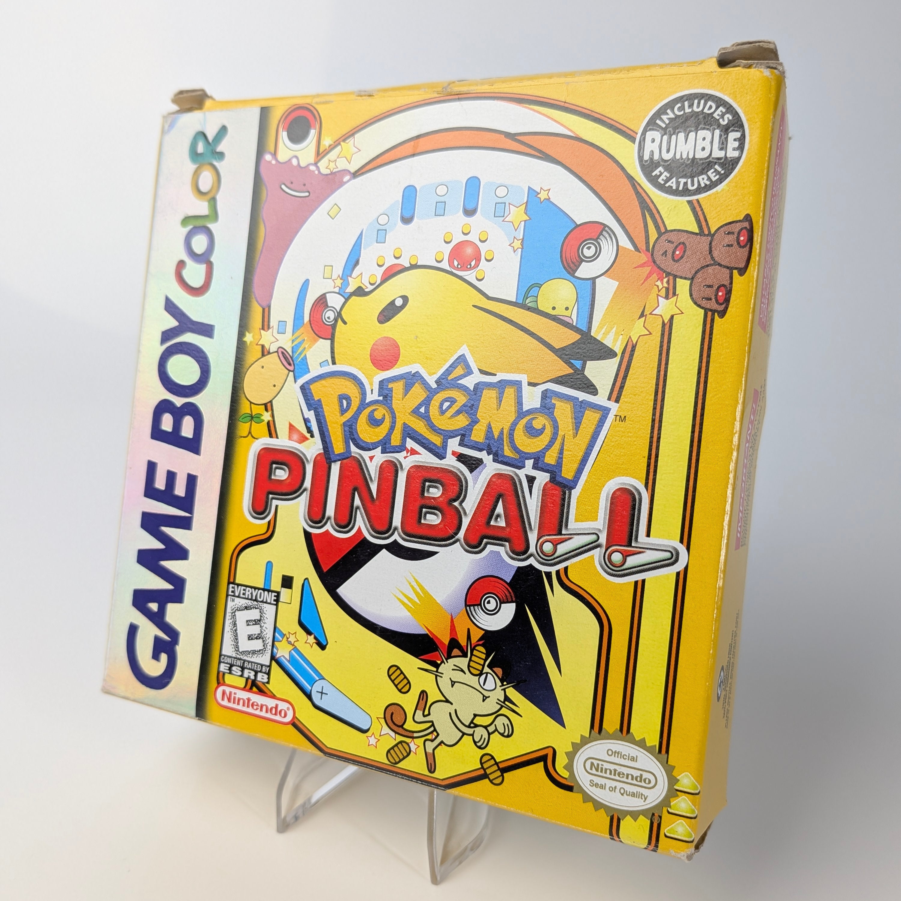 Pokémon Pinball Game Boy Color game case on a stand with a white background