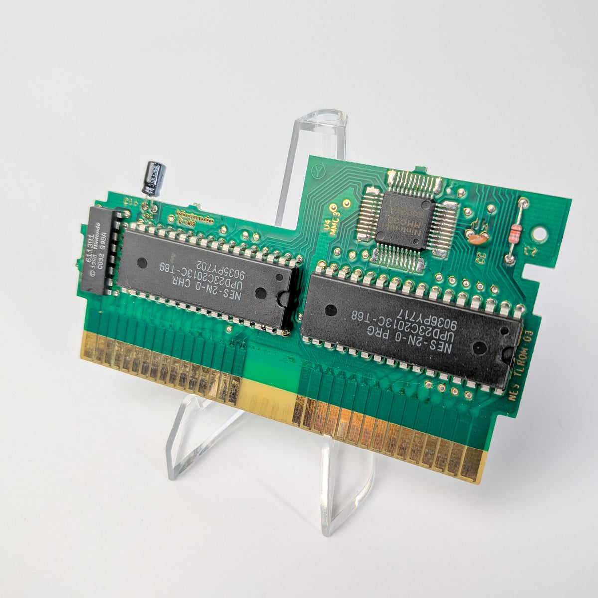 Two green circuit boards on a white background