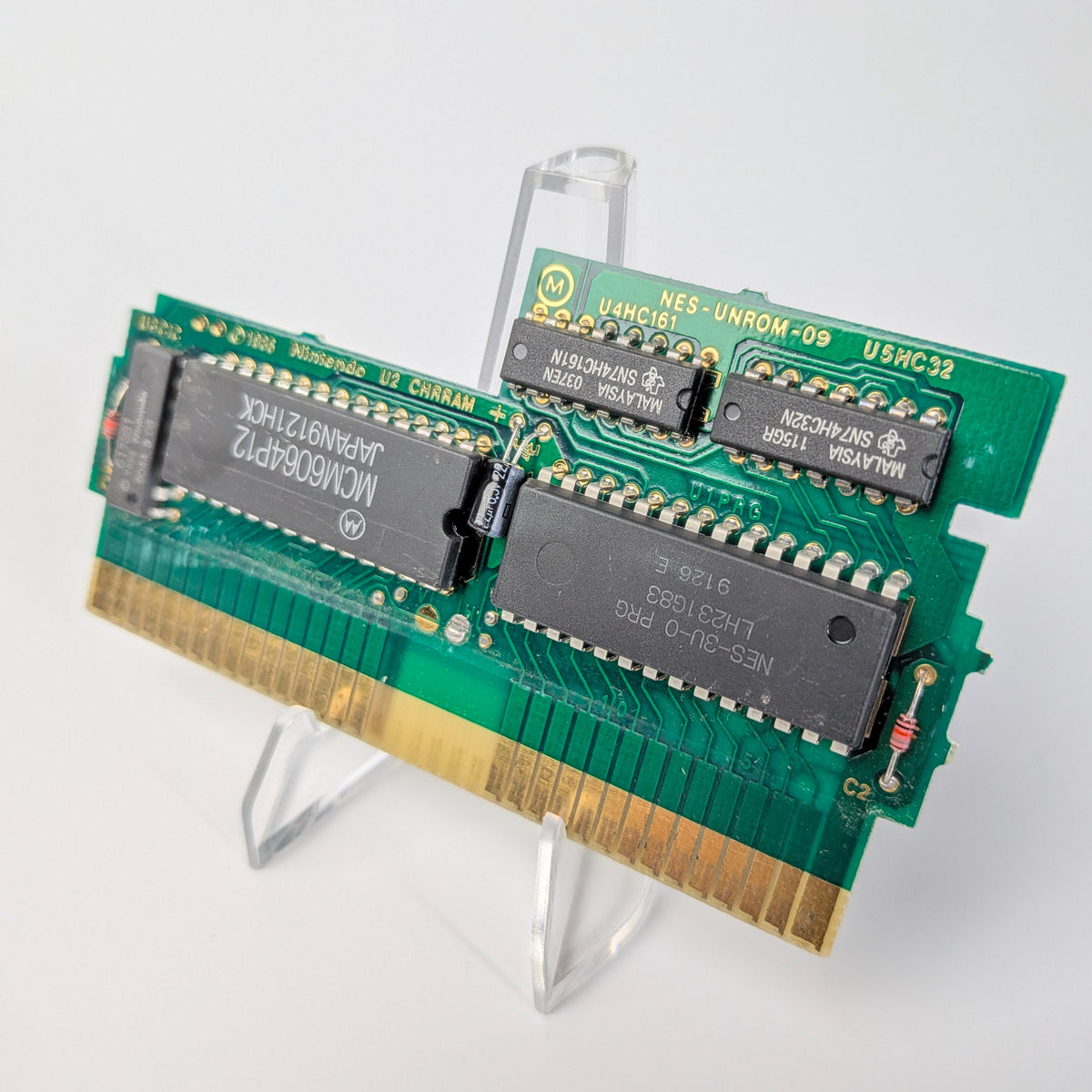 Computer memory module on a stand with a white background