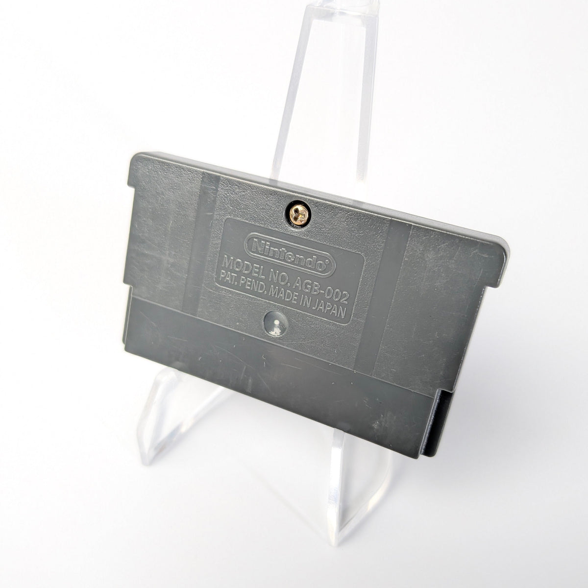 Gray plastic component on a white background