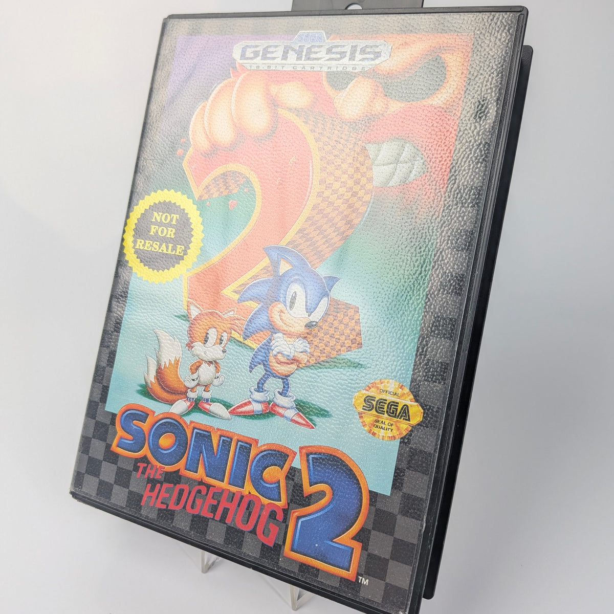 Sega Genesis Sonic the Hedgehog 2 game cartridge on a gray background