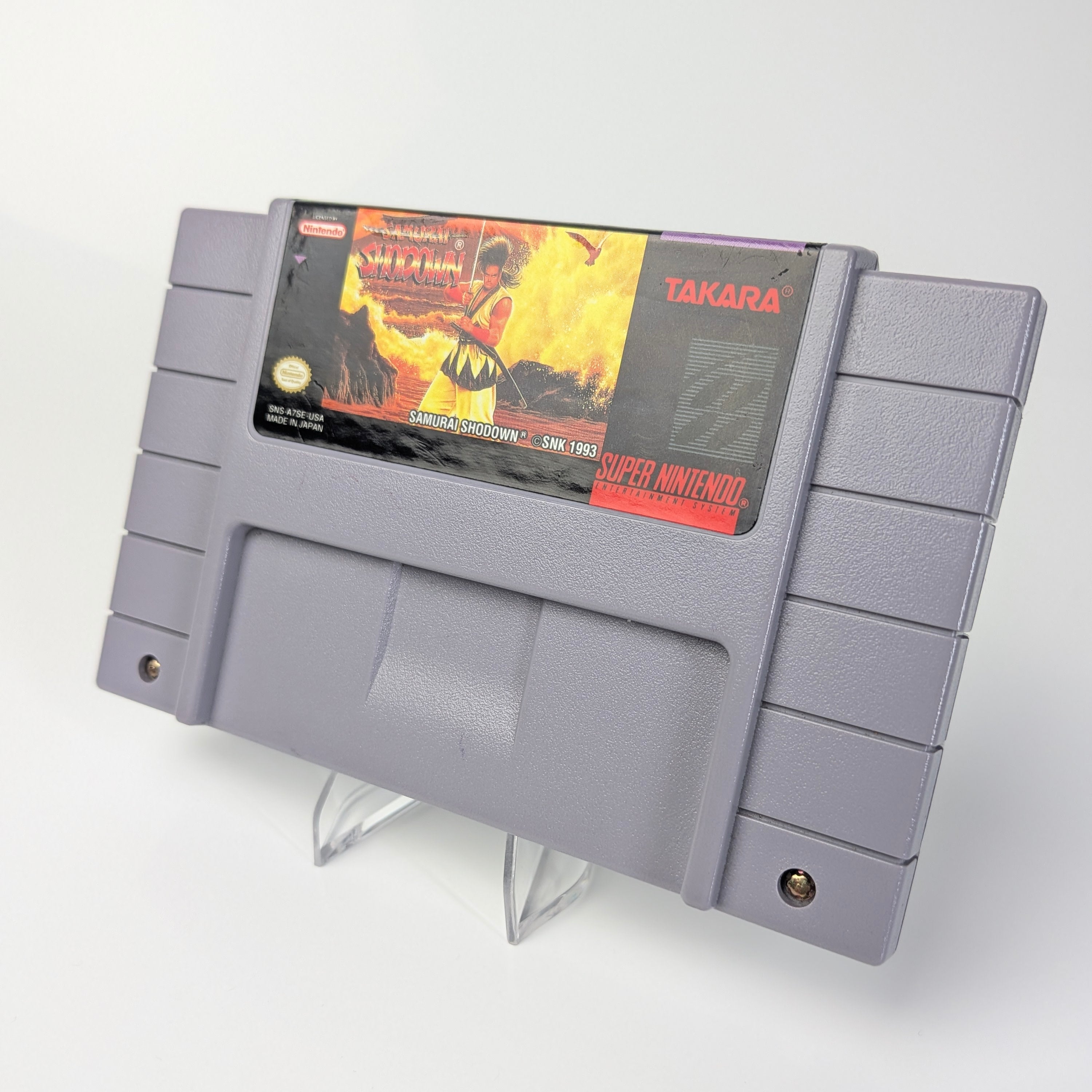 Gray game cartridge with Takara branding on a white background
