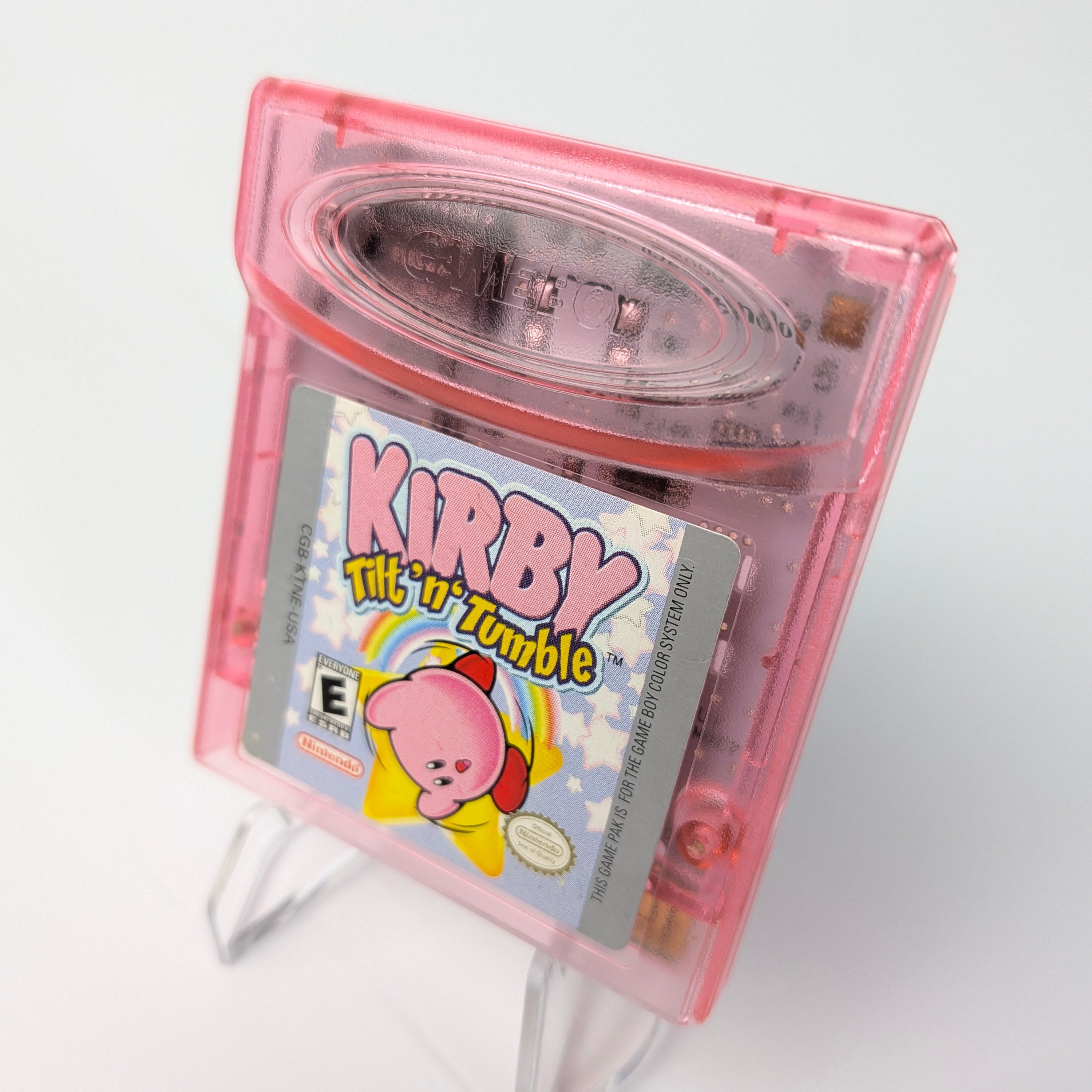 Pink Game Boy cartridge with Kirby game on a white background