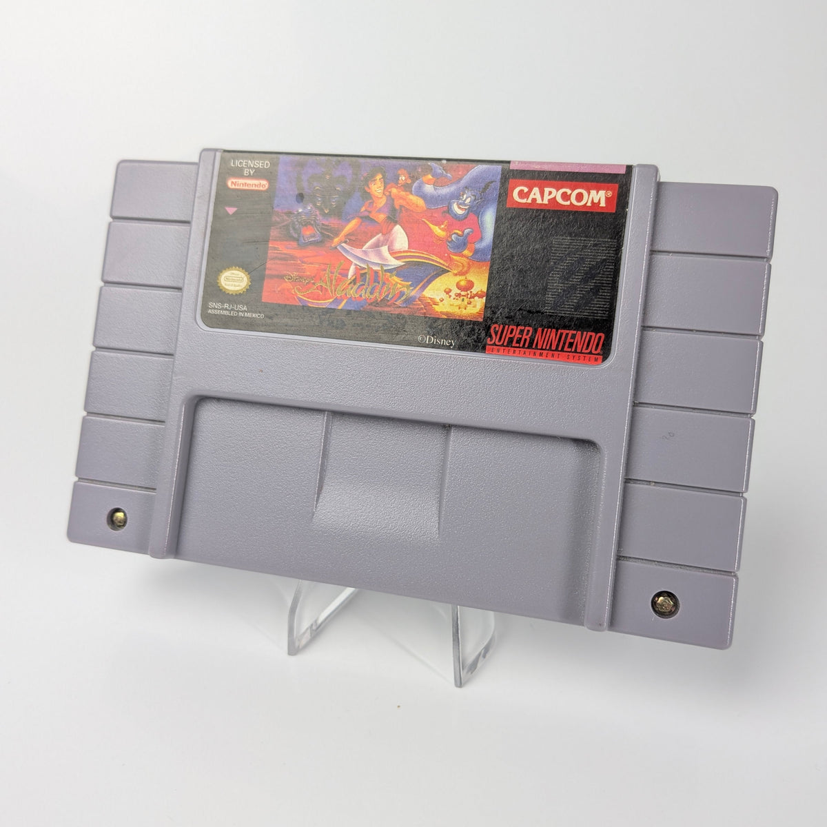 Super Nintendo Entertainment System game cartridge with Capcom logo on a white background