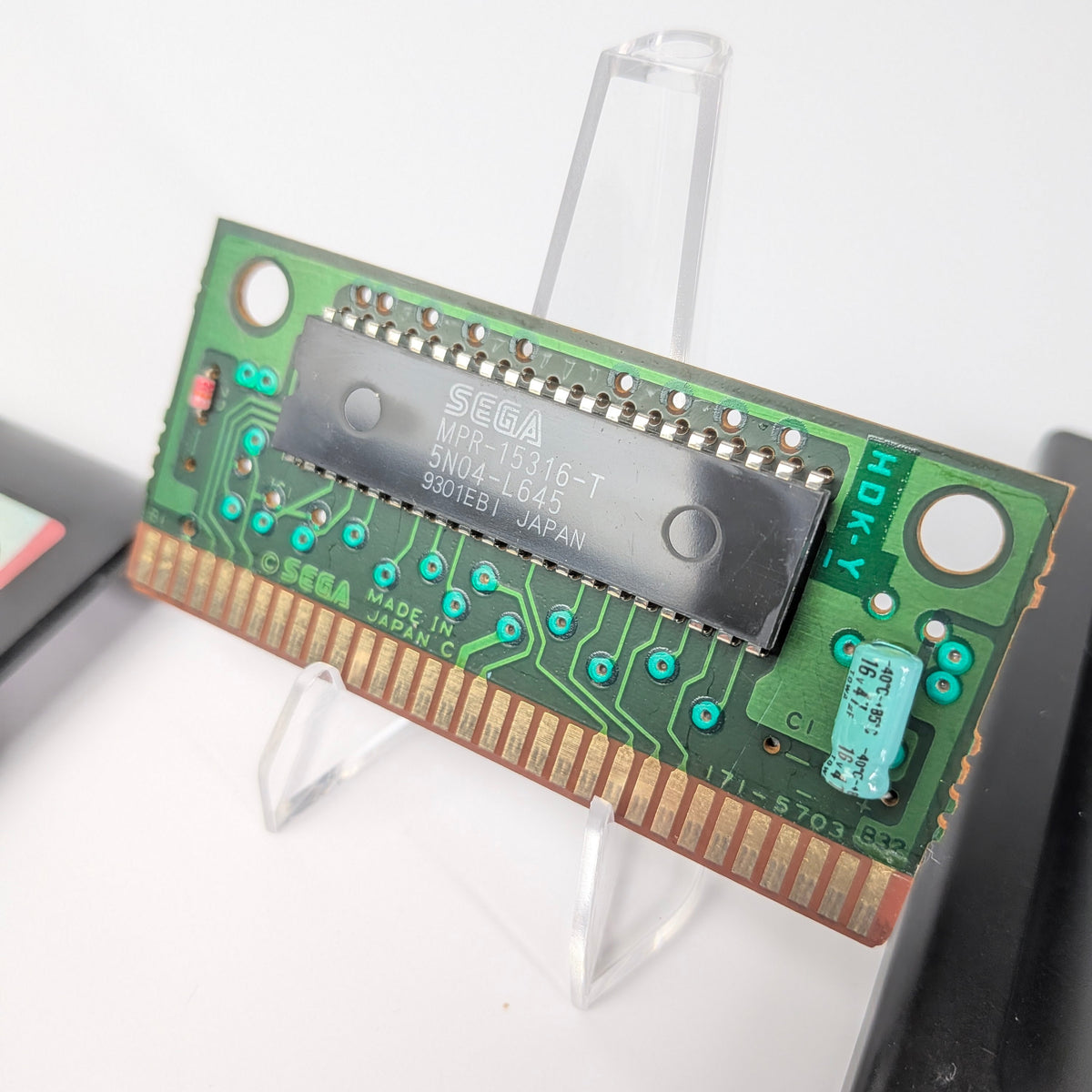 Computer memory module on a stand with a white background