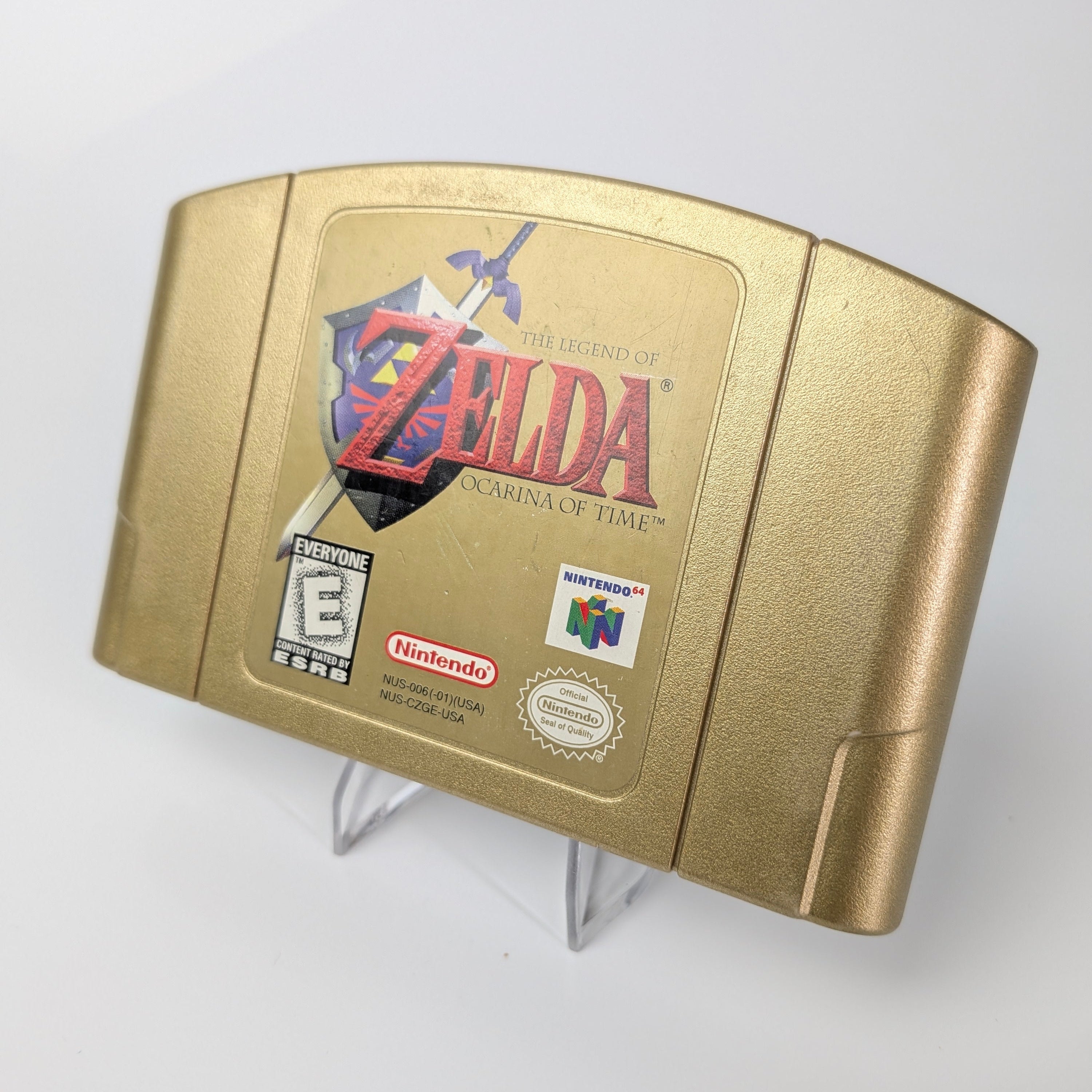 Gold Nintendo 64 game cartridge with 'The Legend of Zelda: A Link to the Past' on a white background