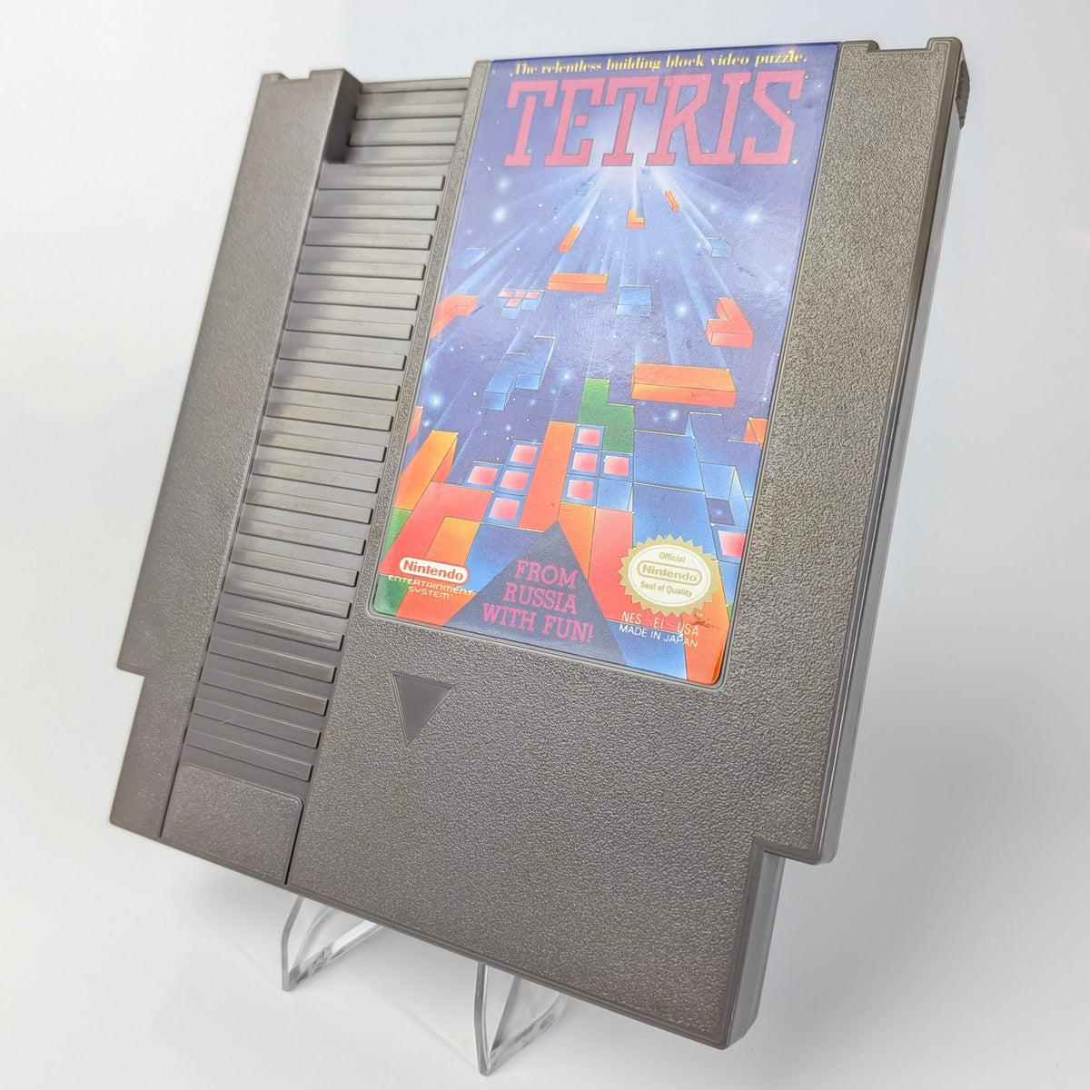 NES cartridge of 'Tetris' on a white background