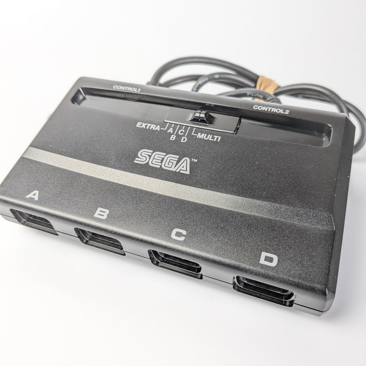 Sega multi-control adapter on a white background